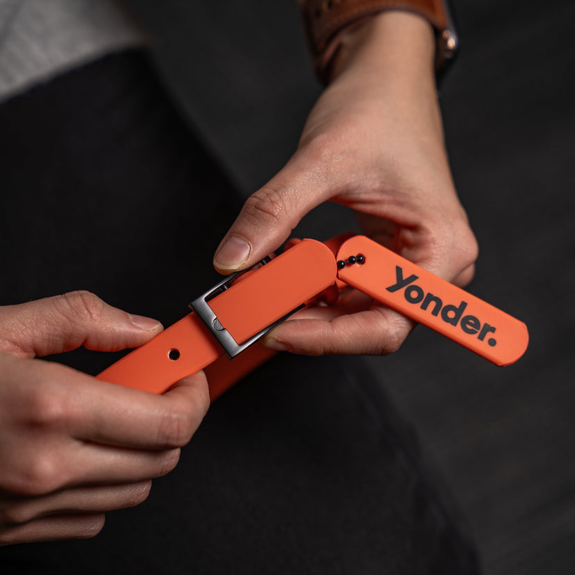 hand holding peach waterproof dog collar